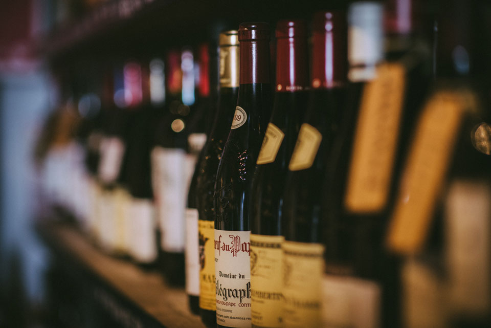 Shelves stacked with bottles of wine Lyme Regis